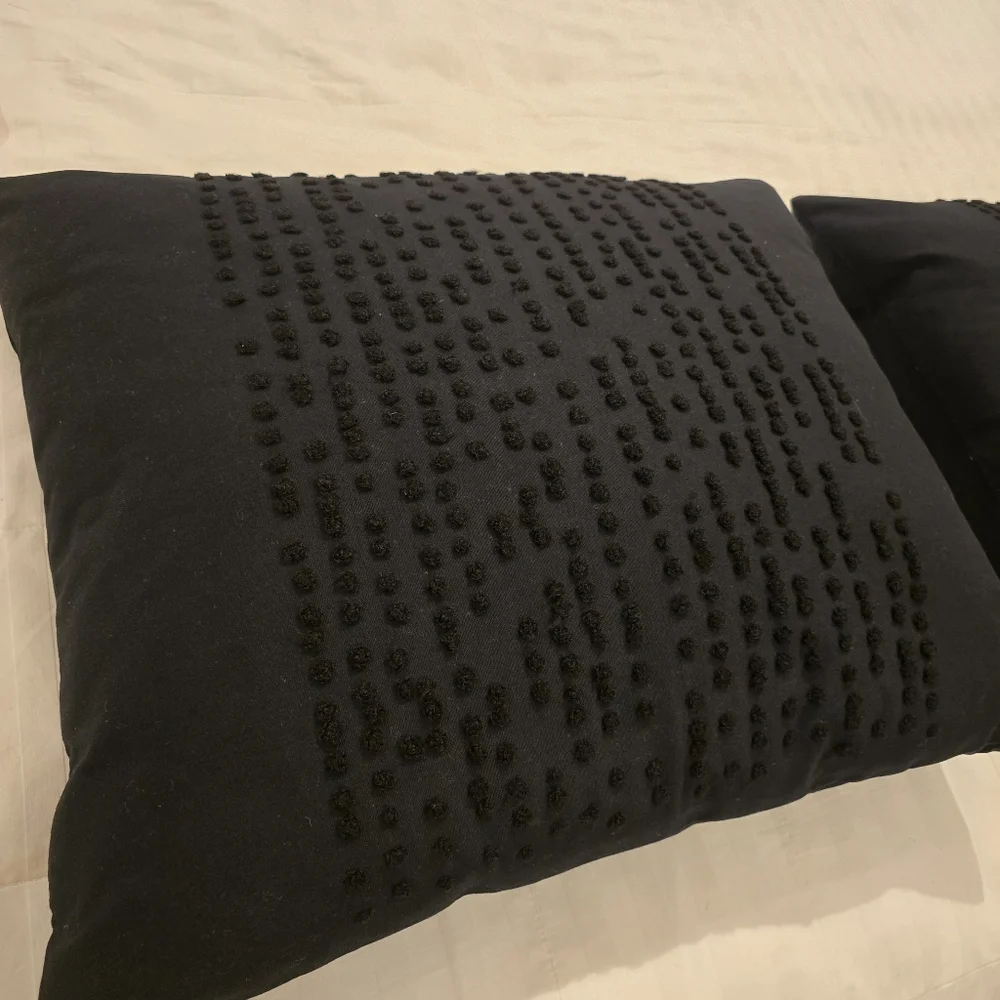 Two Black IKEA Textured Throw Pillows